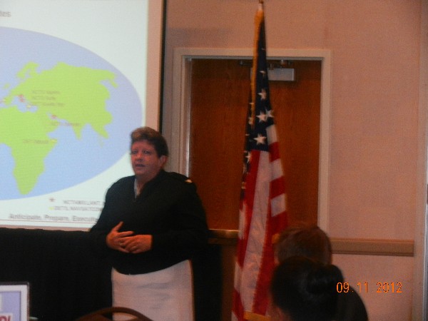Capt. Danelle Barrett, USN, commanding officer, Naval Computer and Telecommunications Area Master Station Atlantic Command, addresses the September chapter luncheon.